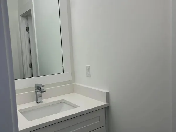 a bathroom with a glass shower door