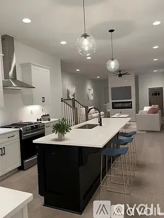 a living room with a couch and a potted plant
