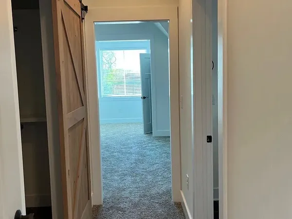 a view of balcony with furniture and garden