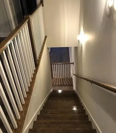 a view of an entryway with wooden floor