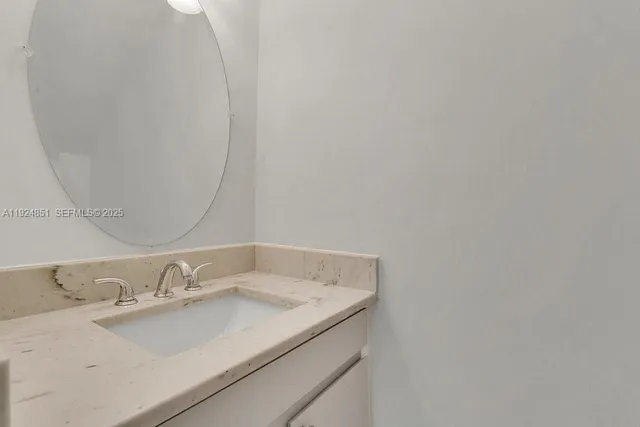 a bathroom with a sink and a vanity