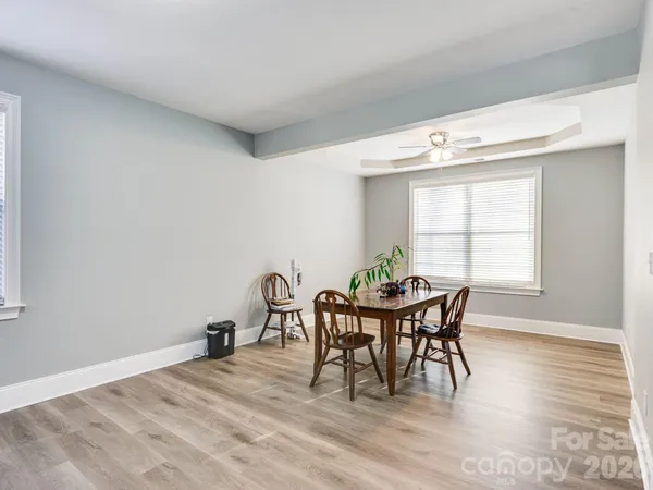 a view of a dining room with furniture and window