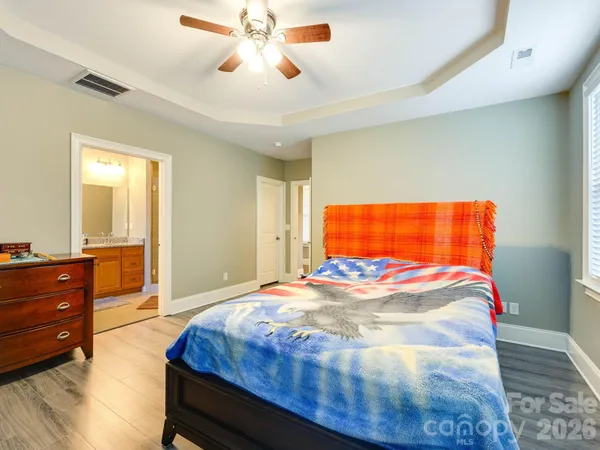 a bed sitting in a room next to a window