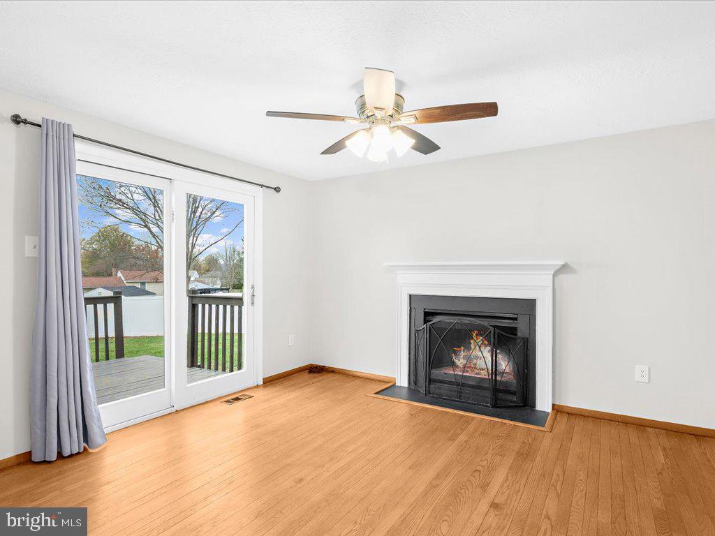 4313 Serpentine Road Middletown, MD 21769 - Photo 22 of 56 Wood burning fireplace, double doors to back yard