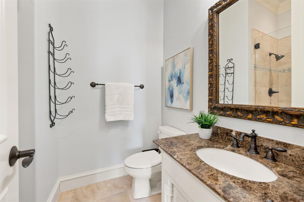 61 Piazza Lane Colleyville, TX 76034 - Photo 28 of 40 Bathroom featuring vanity, a tile shower, and light tile patterned floors
