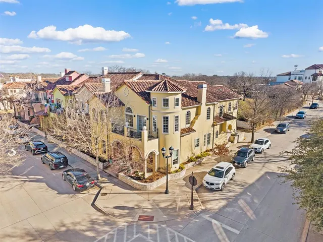 a view of road with swings and slide