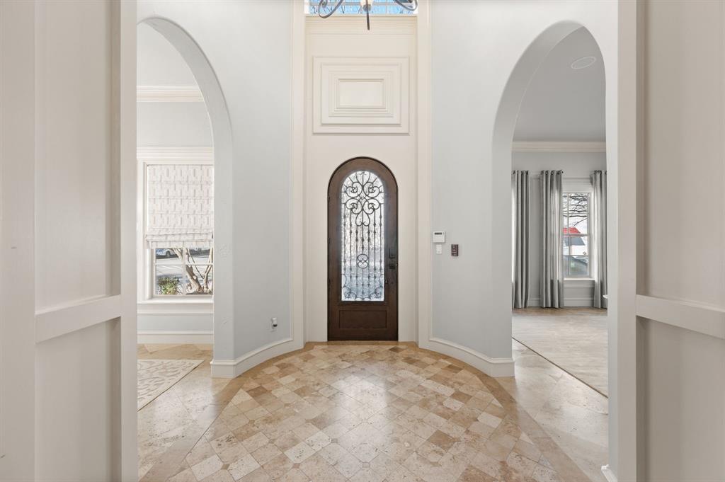 61 Piazza Lane Colleyville, TX 76034 - Photo 7 of 40 Foyer entrance featuring soaring ceilings, ornamental molding and inlaid floor details