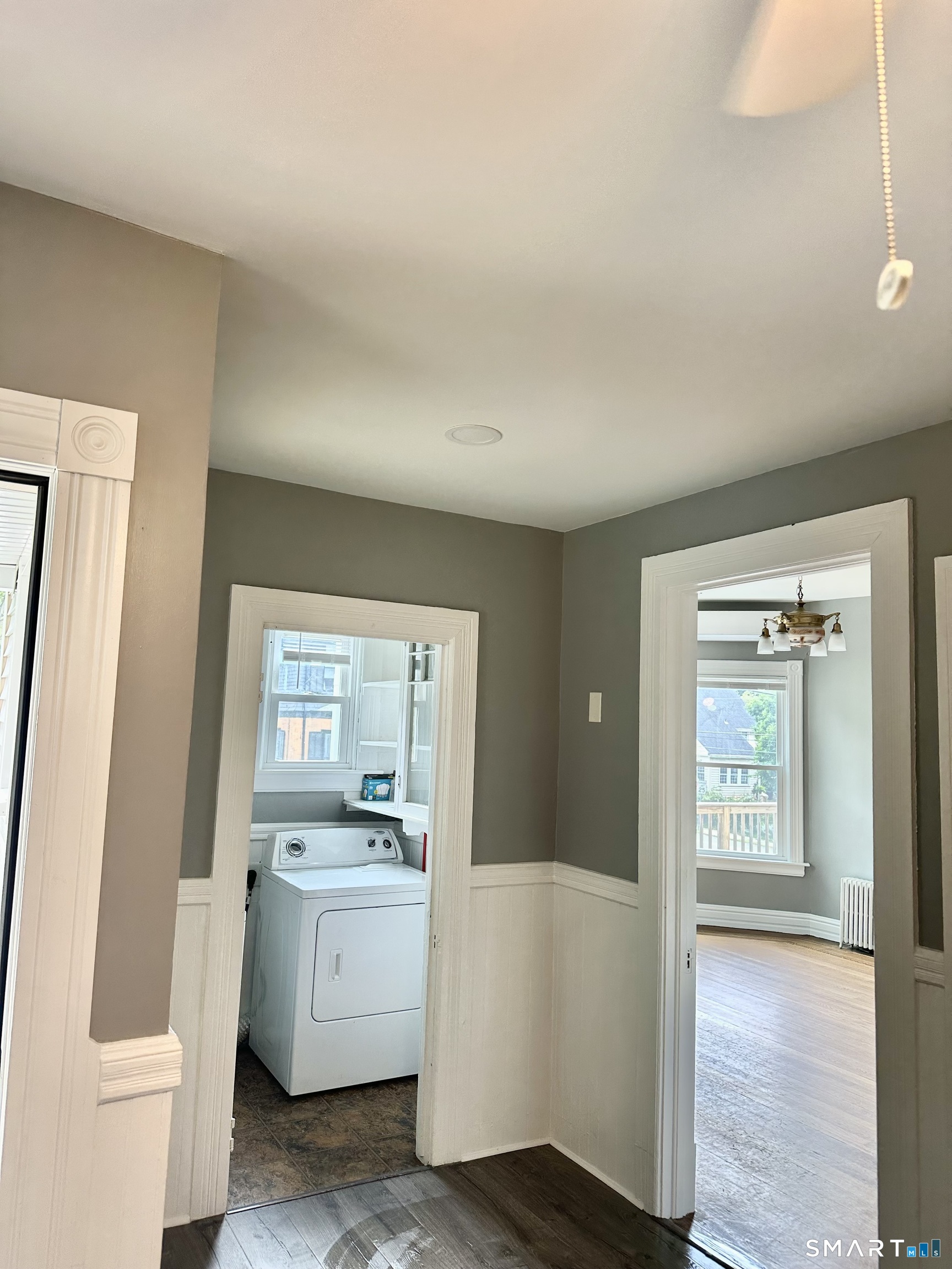 142 Broad Street Norwich, CT 06360 - Photo 21 of 26 a room with a white cabinets and wooden floor