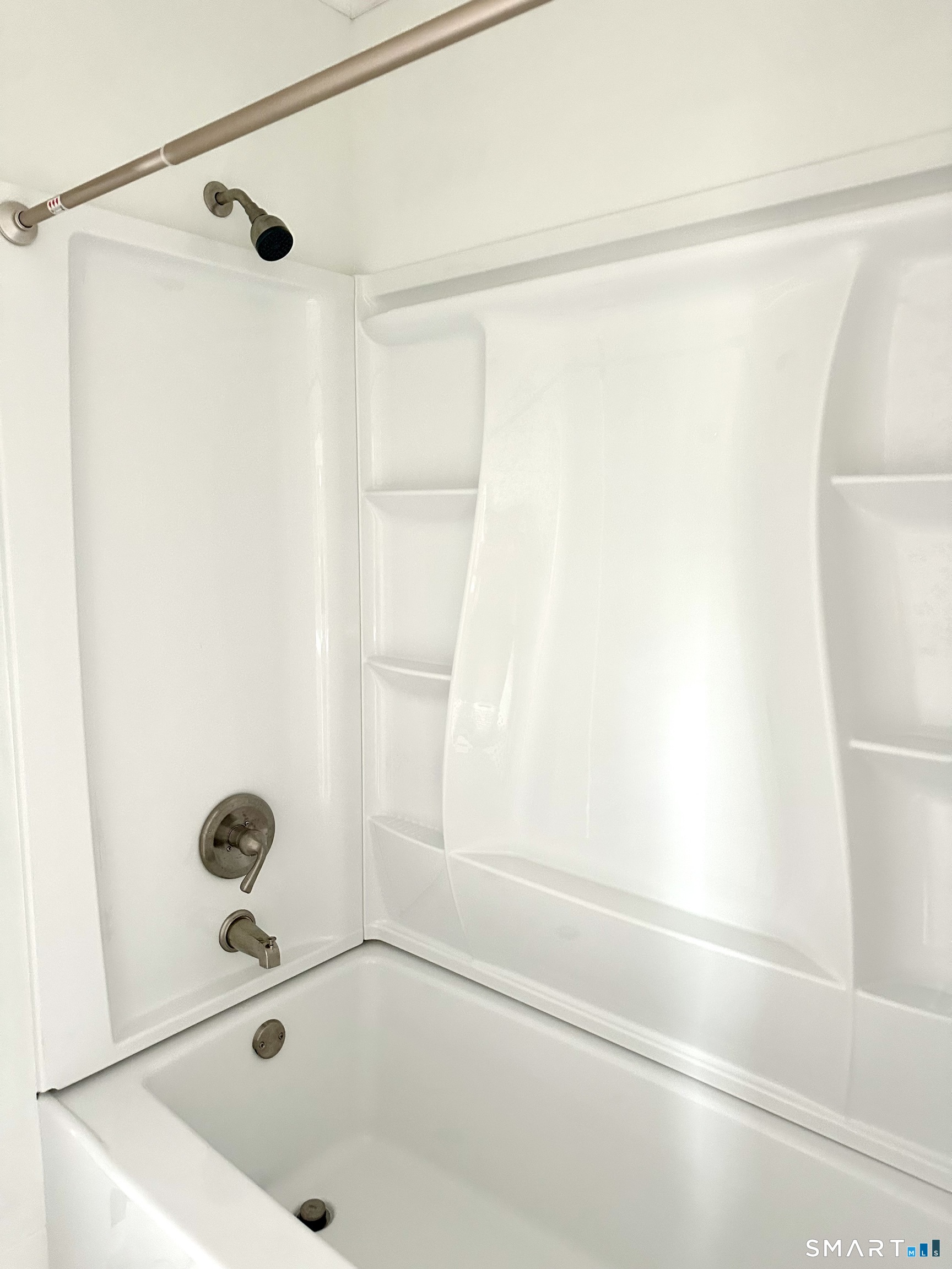142 Broad Street Norwich, CT 06360 - Photo 25 of 26 a bathroom with a tub and a shower