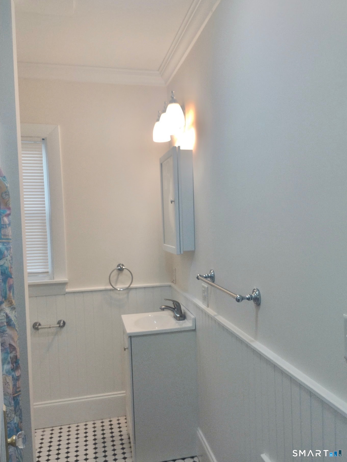 142 Broad Street Norwich, CT 06360 - Photo 26 of 26 a bathroom with a sink and a mirror