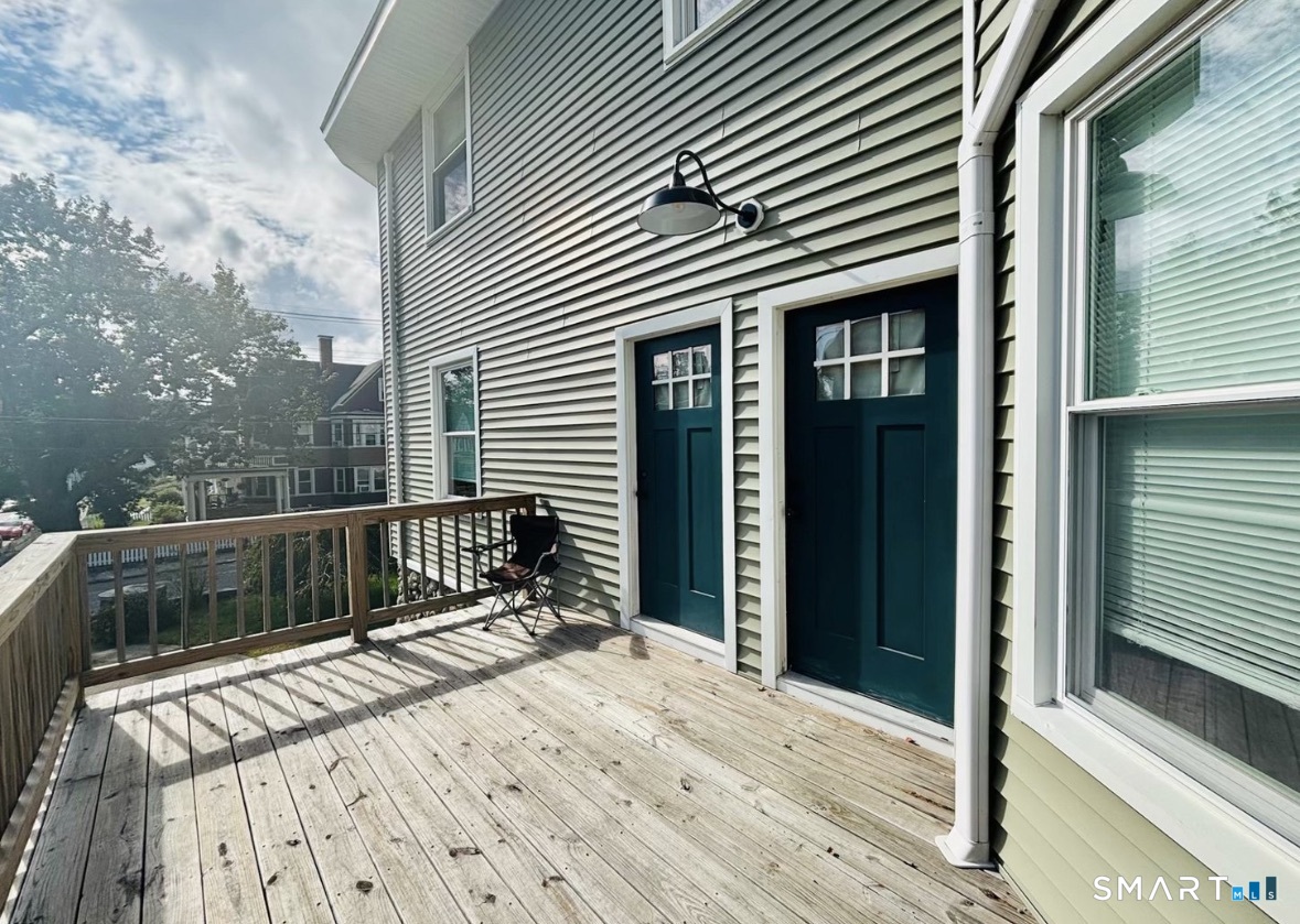 142 Broad Street Norwich, CT 06360 - Photo 3 of 26 a view of balcony with wooden floor