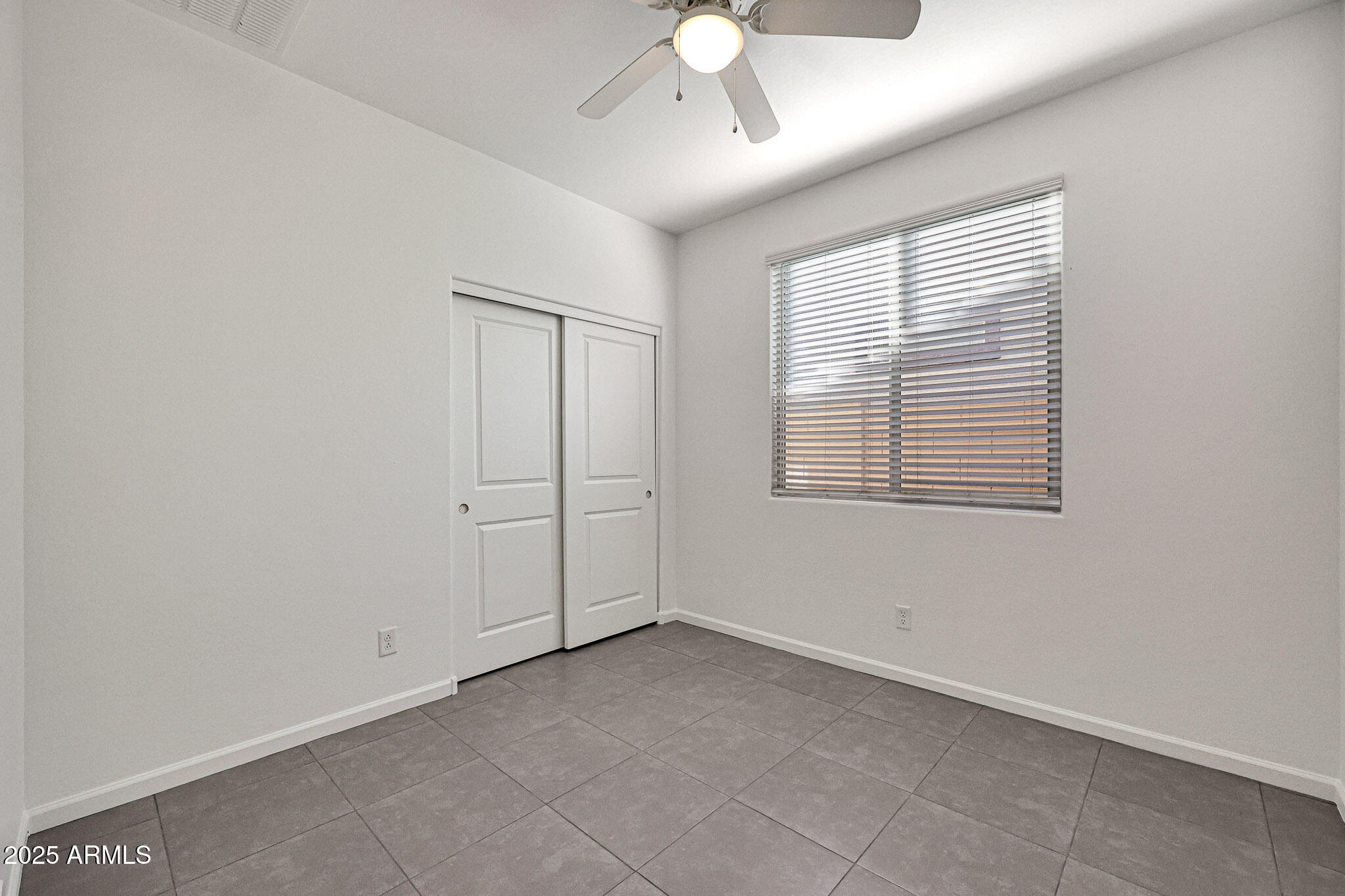 12429 West Midway Avenue Glendale, AZ 85307 - Photo 11 of 22 a view of an empty room with a window