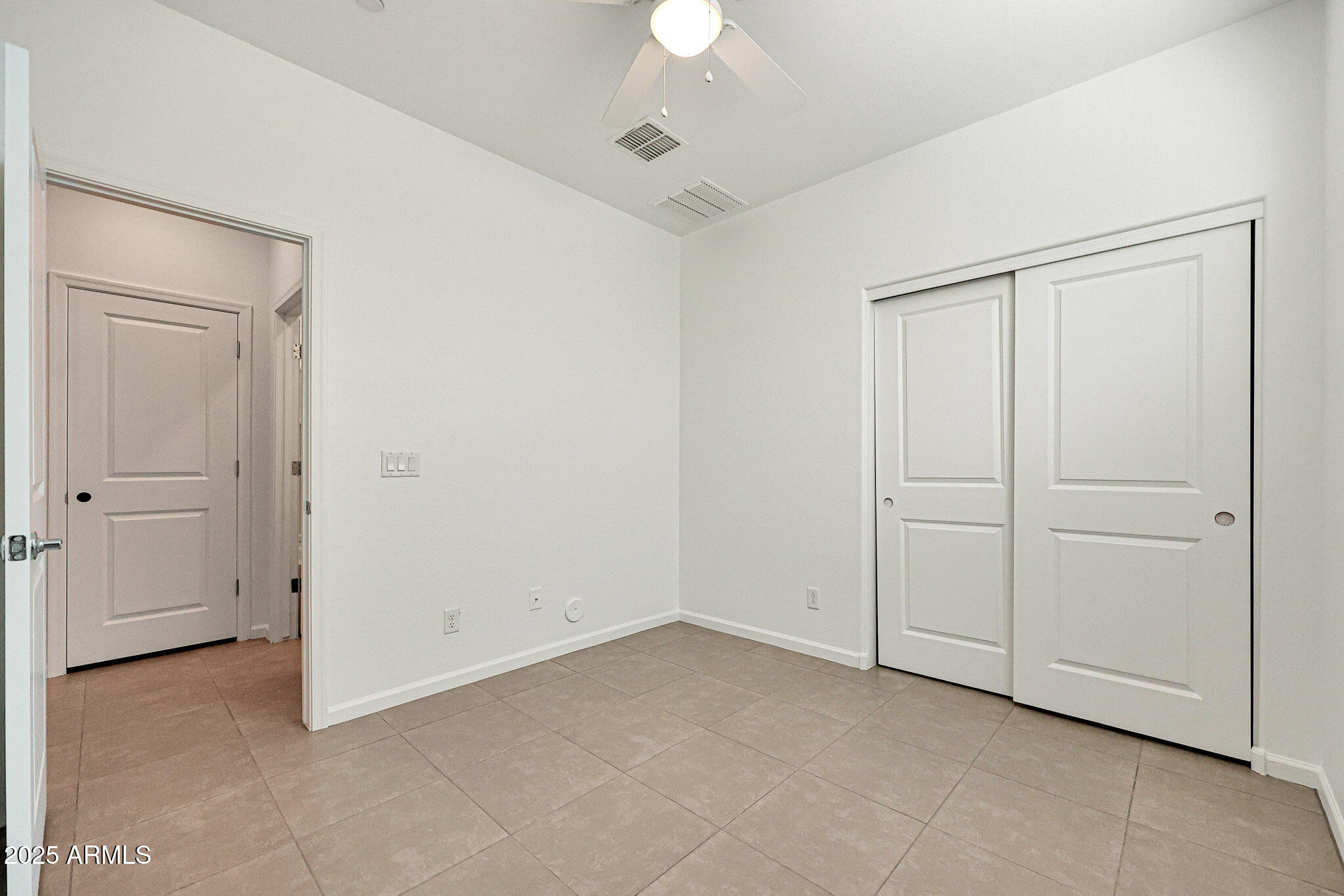 12429 West Midway Avenue Glendale, AZ 85307 - Photo 14 of 22 an empty room with a ceiling fan