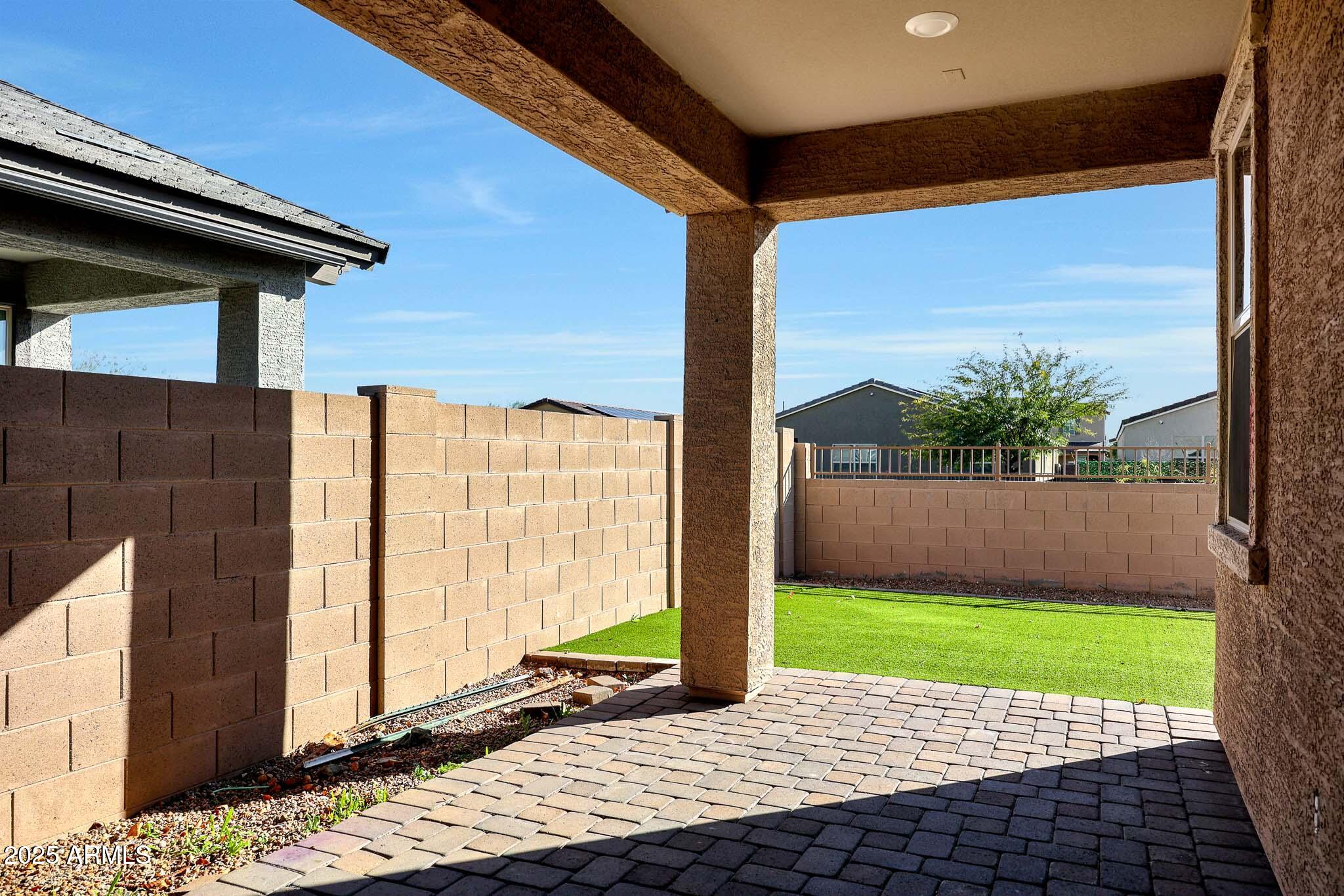 12429 West Midway Avenue Glendale, AZ 85307 - Photo 18 of 22 a view of a porch with a floor to ceiling window next to a yard