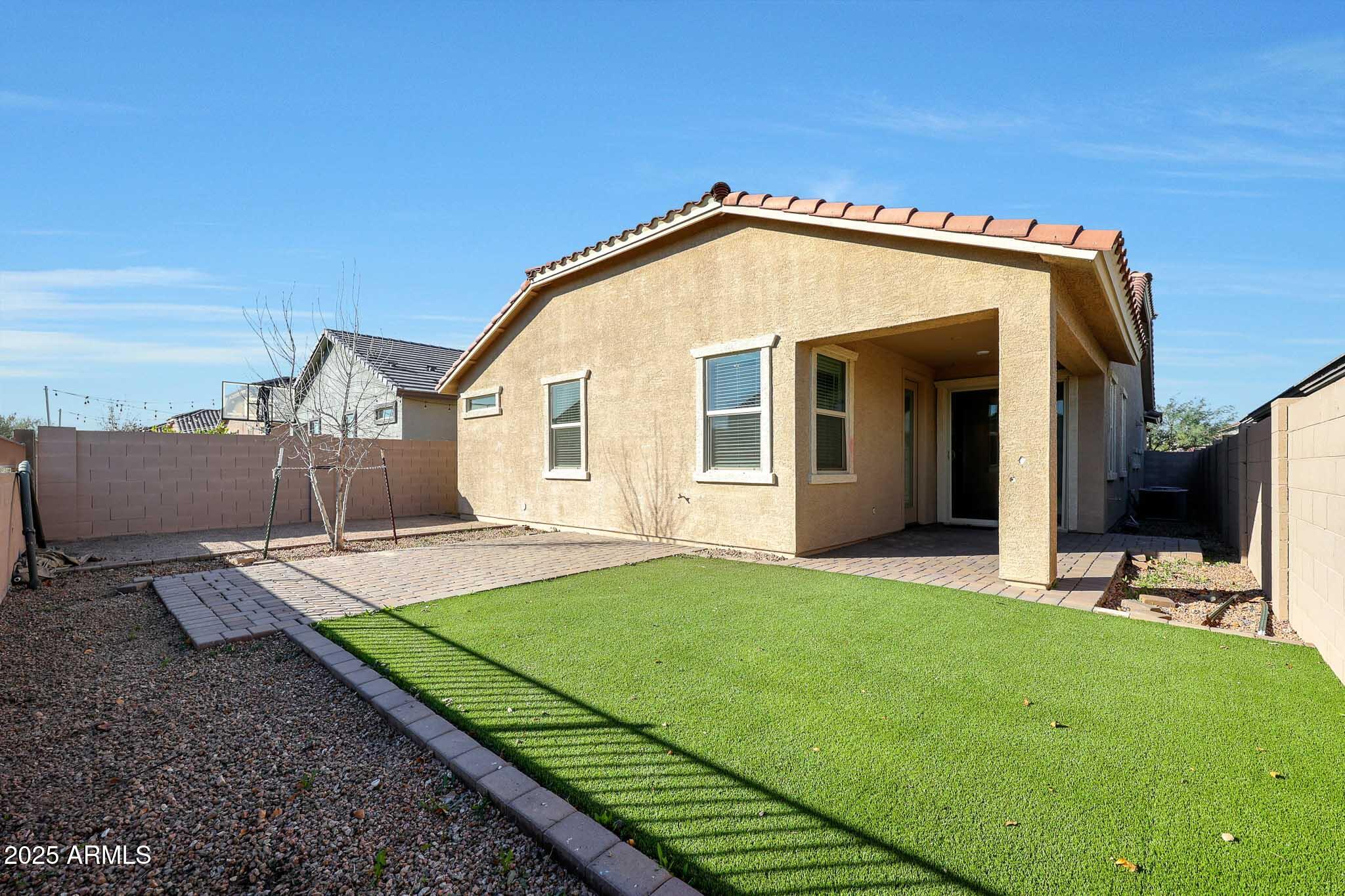 12429 West Midway Avenue Glendale, AZ 85307 - Photo 19 of 22 a view of a house with backyard and porch