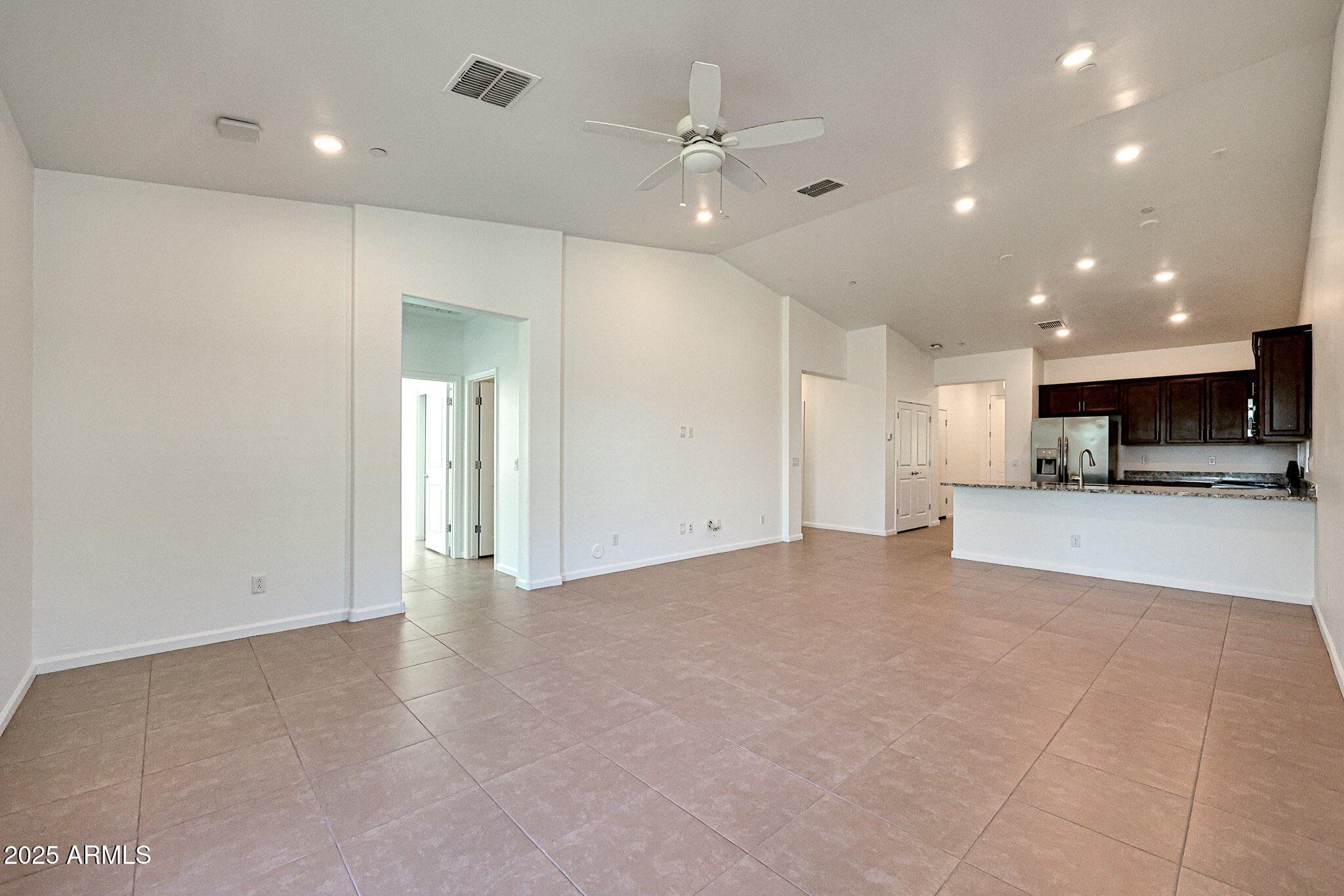 12429 West Midway Avenue Glendale, AZ 85307 - Photo 6 of 22 a view of an empty room with a kitchen