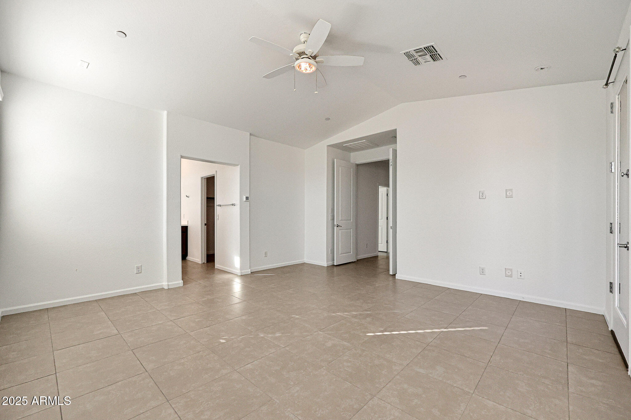 12429 West Midway Avenue Glendale, AZ 85307 - Photo 8 of 22 a view of an empty room with a ceiling fan
