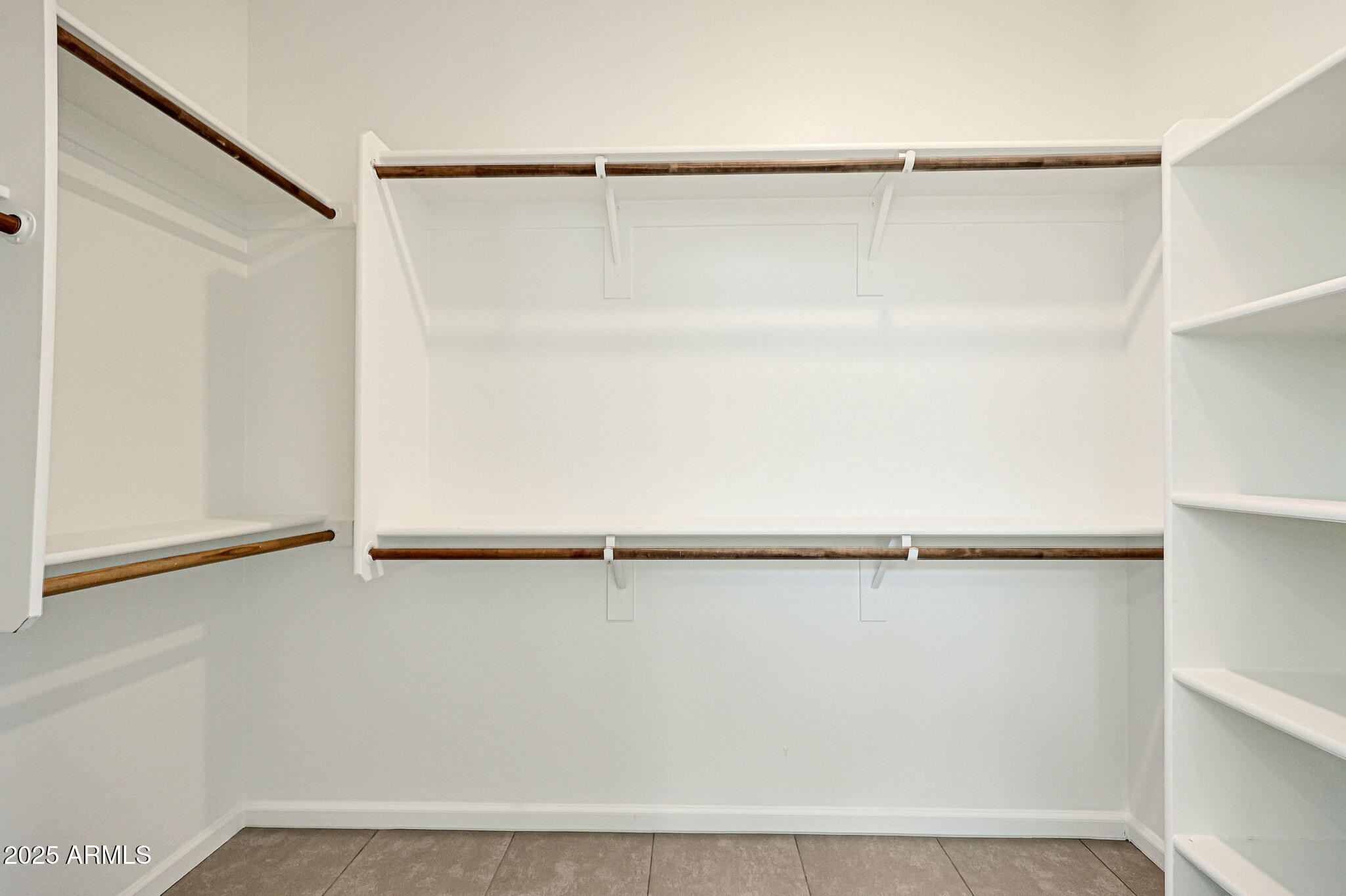 12429 West Midway Avenue Glendale, AZ 85307 - Photo 10 of 22 a view of a walk in closet