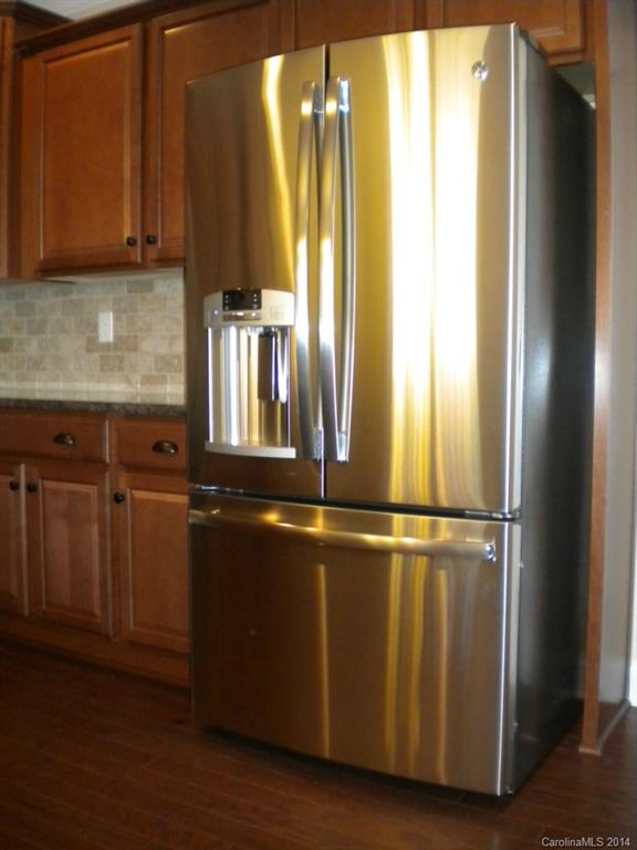 78074 Rillstone Drive, Unit 196 Lancaster, SC 29720 - Photo 11 of 24 a close view of kitchen with stainless steel appliances granite countertop a refrigerator and a sink