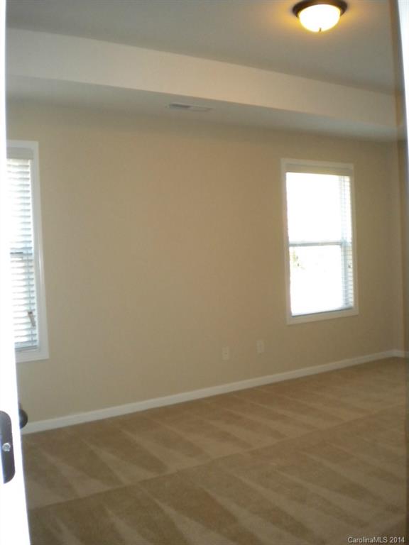 78074 Rillstone Drive, Unit 196 Lancaster, SC 29720 - Photo 17 of 24 a view of an empty room with a window