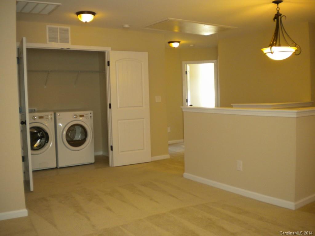 78074 Rillstone Drive, Unit 196 Lancaster, SC 29720 - Photo 20 of 24 a view of a storage & utility room with a washer dryer