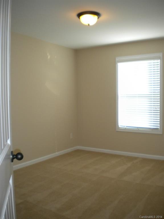 78074 Rillstone Drive, Unit 196 Lancaster, SC 29720 - Photo 22 of 24 an empty room with a window