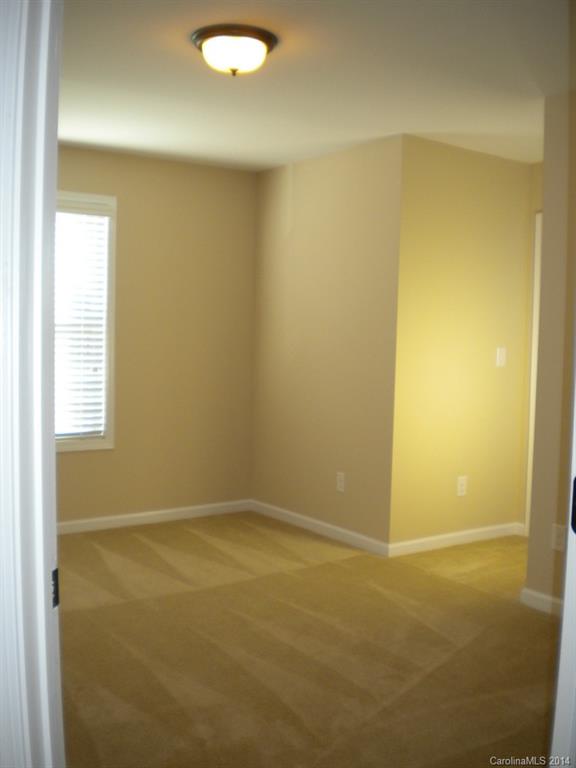 78074 Rillstone Drive, Unit 196 Lancaster, SC 29720 - Photo 23 of 24 a view of an empty room with a window