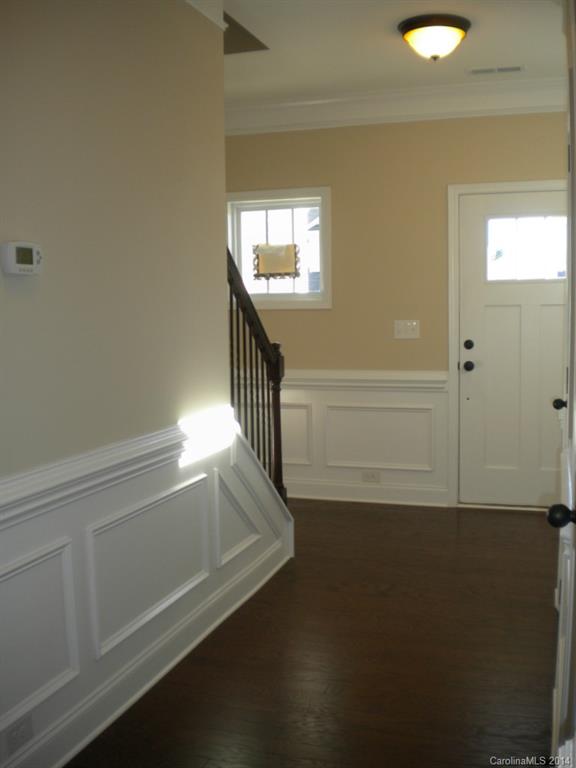 78074 Rillstone Drive, Unit 196 Lancaster, SC 29720 - Photo 5 of 24 a view of entryway and hall with wooden floor