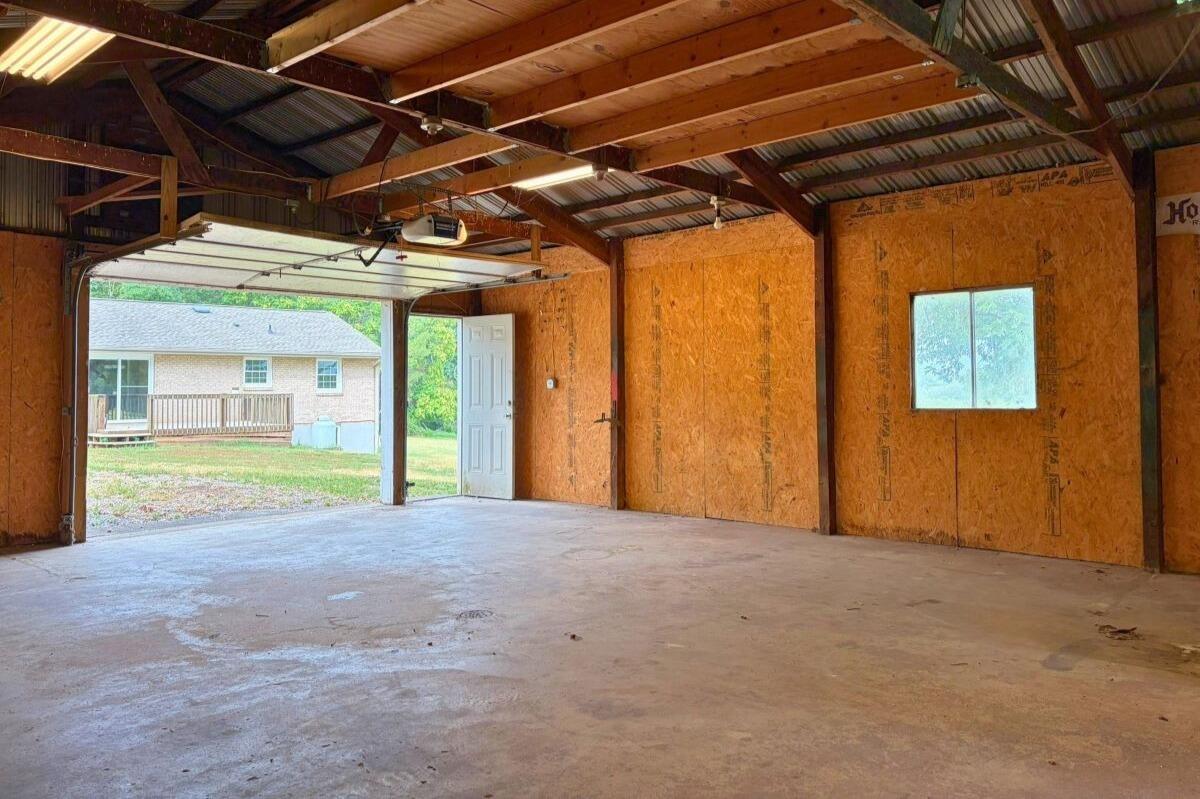 1069 Pecks Road Bedford, VA 24523 - Photo 38 of 47 Garage with concrete floor and electric
