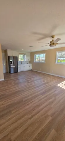 a view of a livingroom with wooden floor
