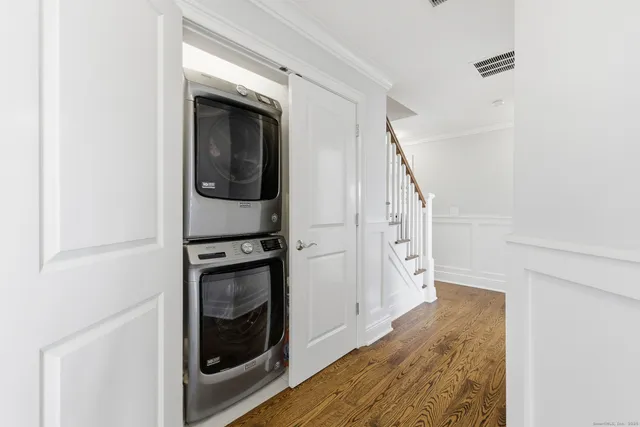 a view of a hallway with washer and dryer