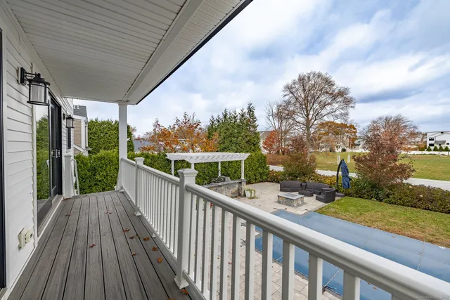 a view of a balcony with wooden floor