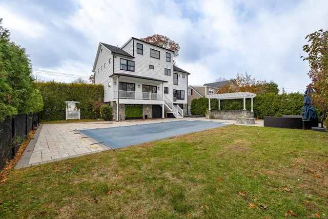a view of house with a yard