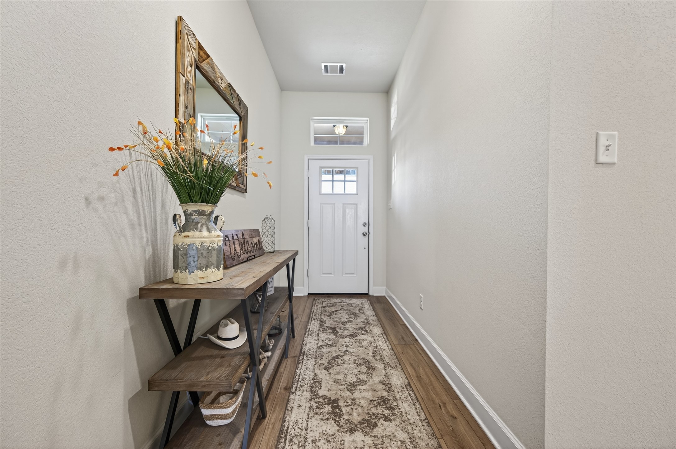 917 Farm Path Brenham, TX 77833 - Photo 5 of 43 a view of an entryway with table and mirror