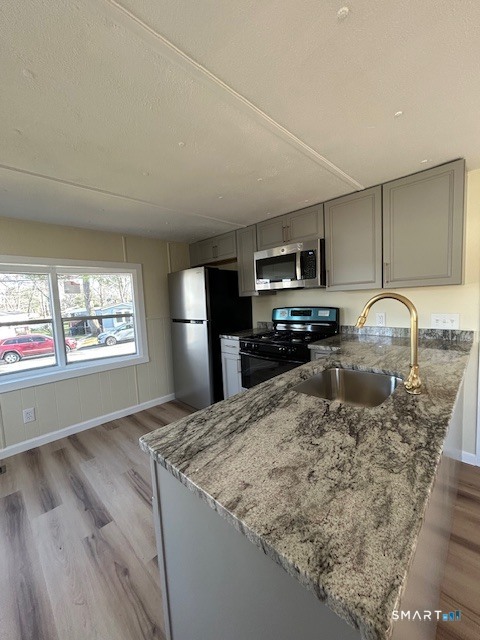 18 Fairway Drive Windham, CT 06256 - Photo 4 of 15 a kitchen with a sink stove and refrigerator