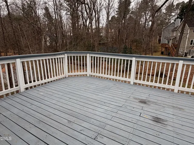 a view of deck with wooden floor and fence