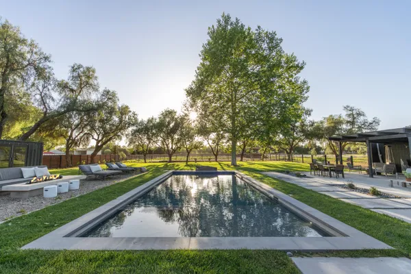 a swimming pool view with a outdoor space