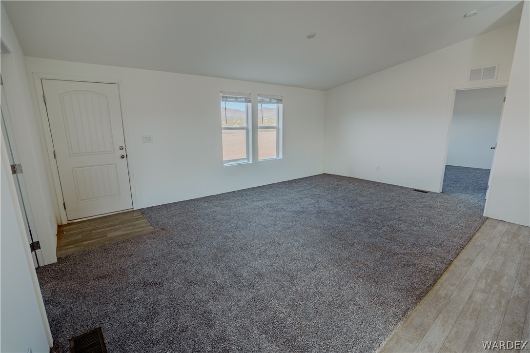 5746 Eden Road Golden Valley, AZ 86413 - Photo 9 of 27 an empty room with windows