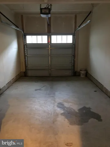 a view of a room with a ceiling fan