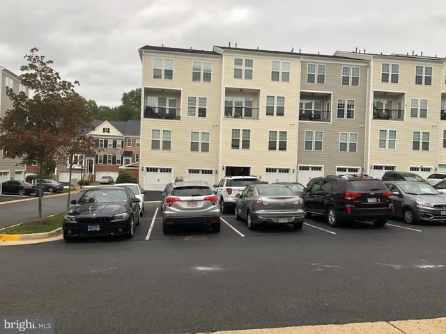a parked cars parked in front of a building