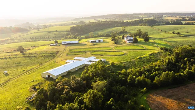 a view of a swimming pool with a table and chairs