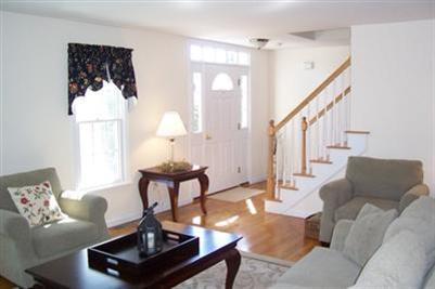9 Shady Lane Chatham, MA 02633 - Photo 3 of 19 a living room with furniture a lamp and a potted plant