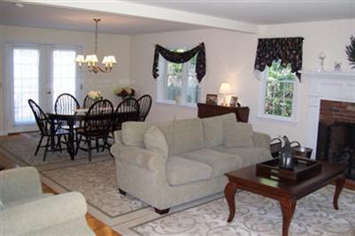 9 Shady Lane Chatham, MA 02633 - Photo 5 of 19 a living room with furniture chandelier and a fireplace