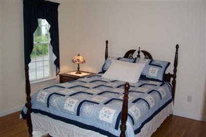 9 Shady Lane Chatham, MA 02633 - Photo 10 of 19 a bedroom with bed and a window