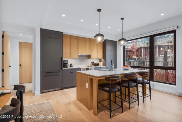 a kitchen with a table and chairs in it