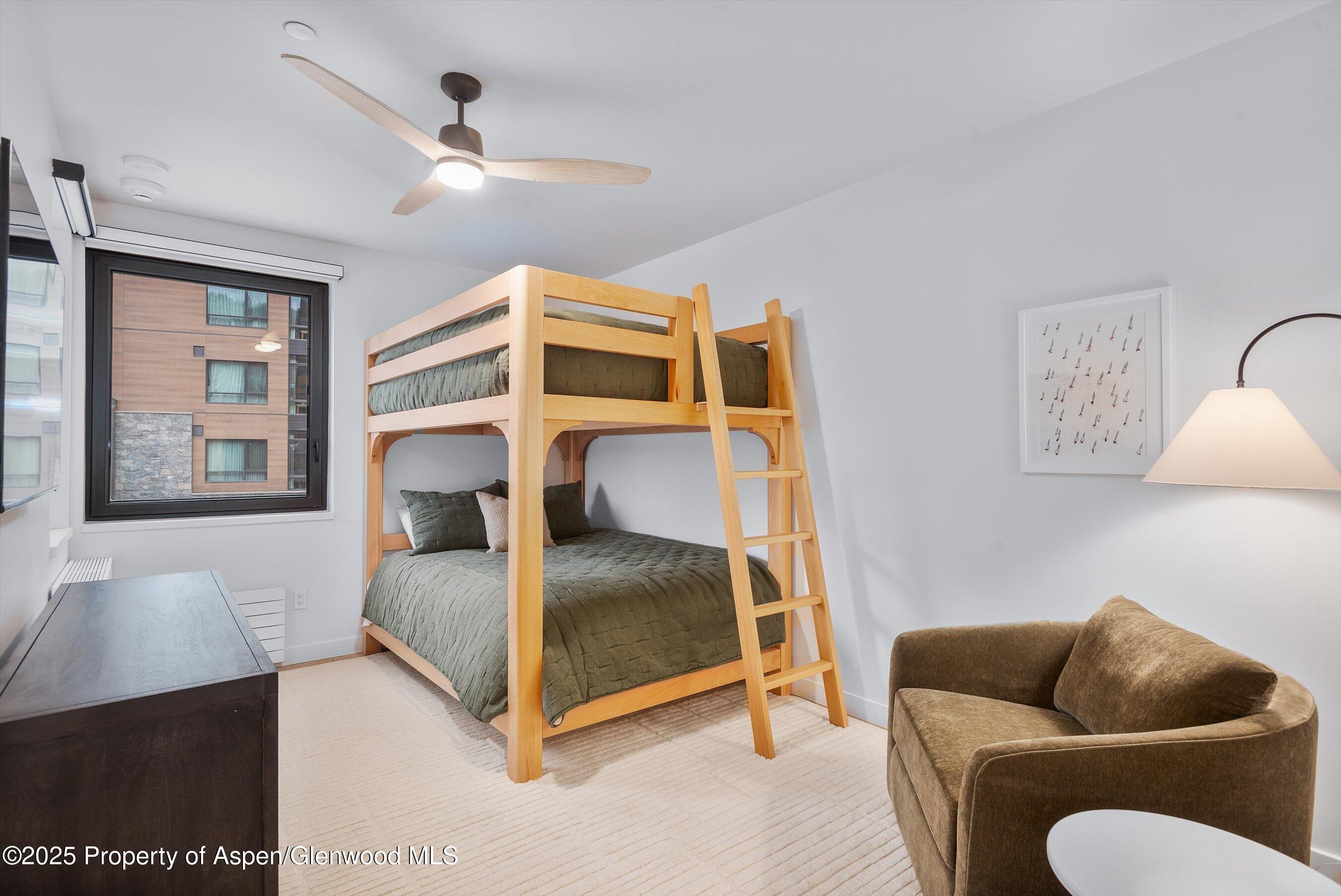 119 Wood Road, Unit 101 Snowmass Village, CO 81615 - Photo 20 of 34 a bedroom with a bed and window