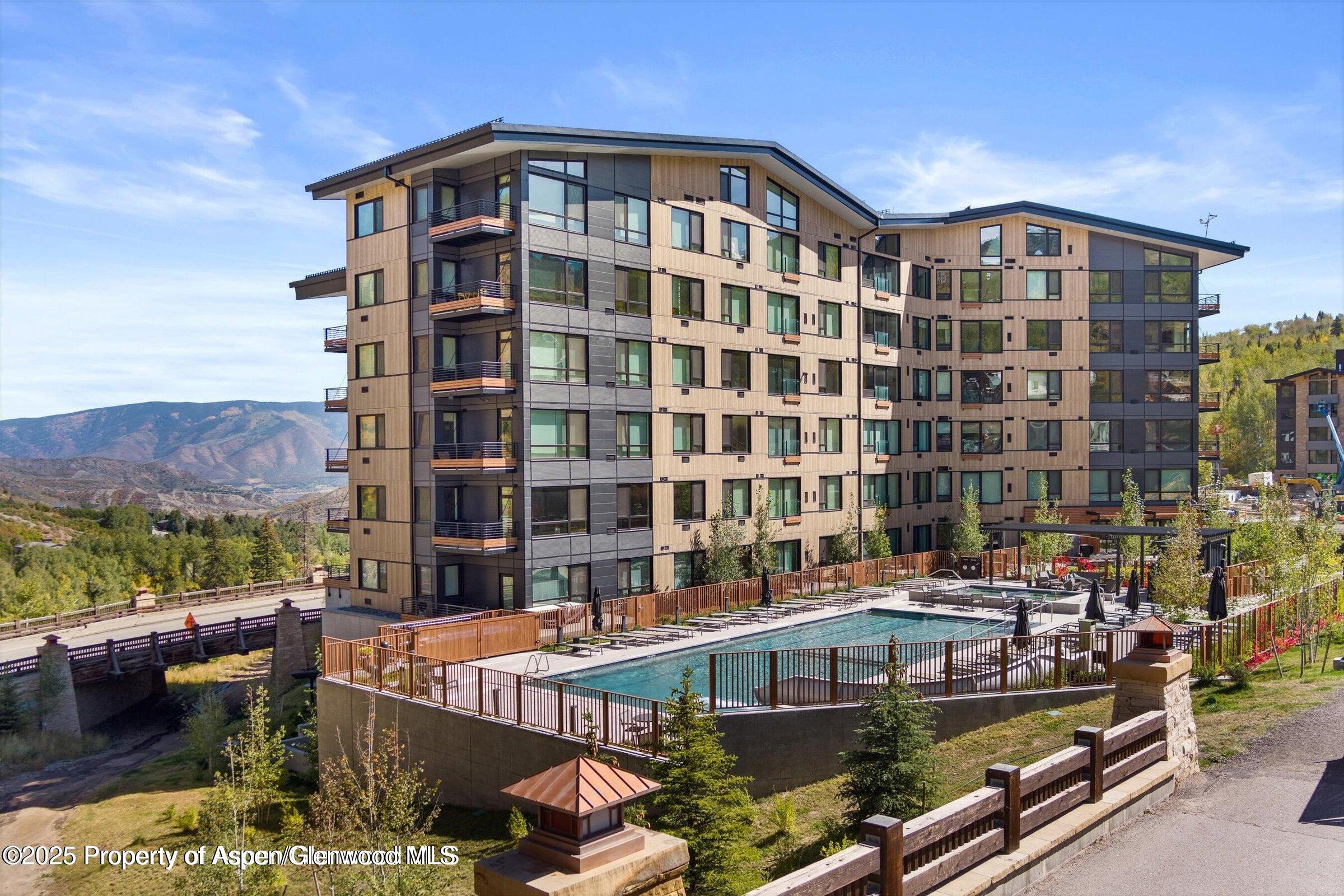 119 Wood Road, Unit 101 Snowmass Village, CO 81615 - Photo 2 of 34 a front view of a building with street view