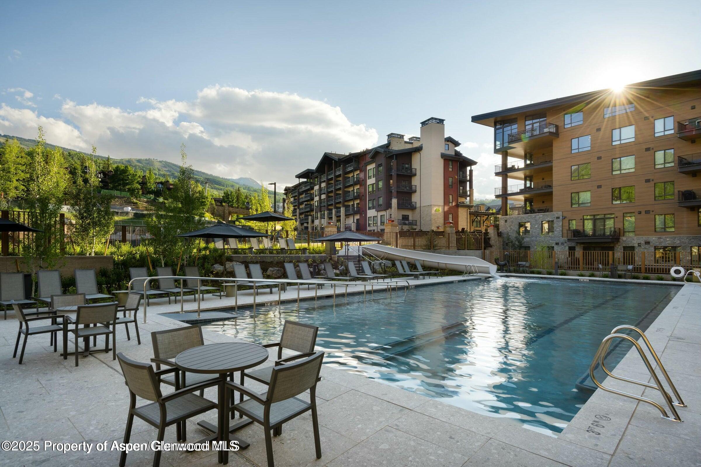 119 Wood Road, Unit 101 Snowmass Village, CO 81615 - Photo 3 of 34 a terrace with outdoor seating and city view