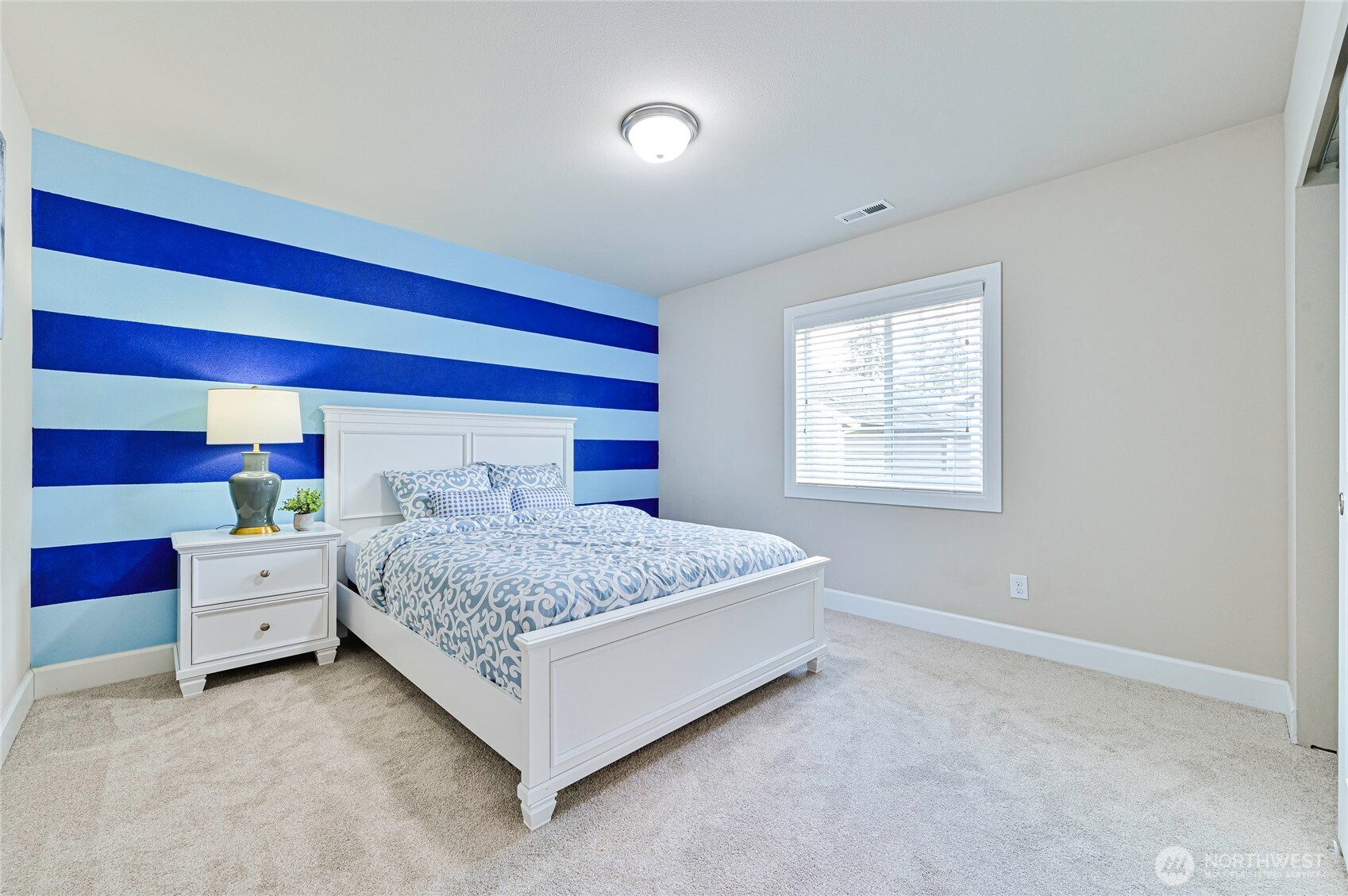 17312 40th Avenue Southeast Bothell, WA 98012 - Photo 25 of 34 a bedroom with a bed and a window