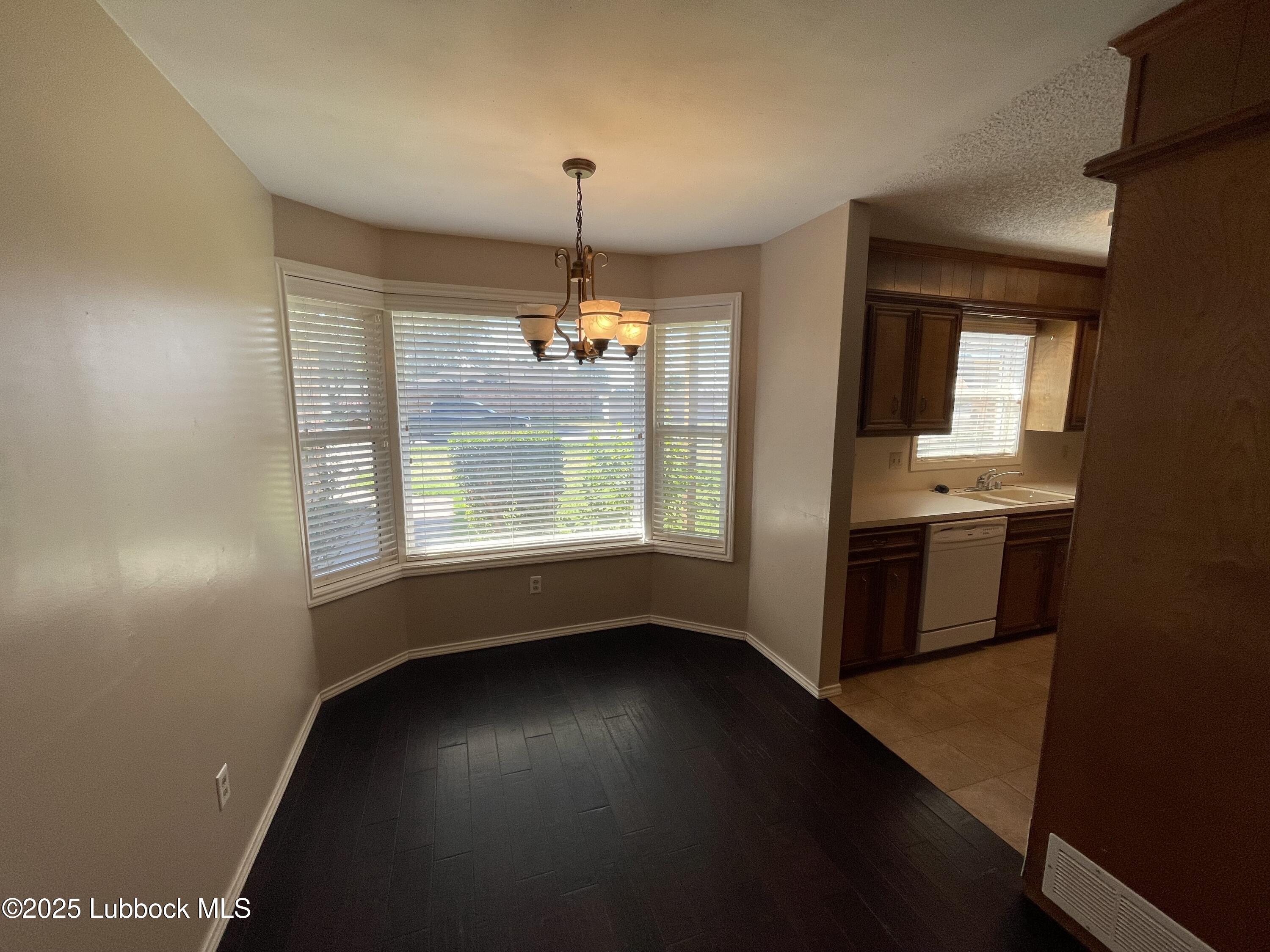 6619 Huron Avenue Lubbock, TX 79424 - Photo 3 of 10 a view of an empty room with a window